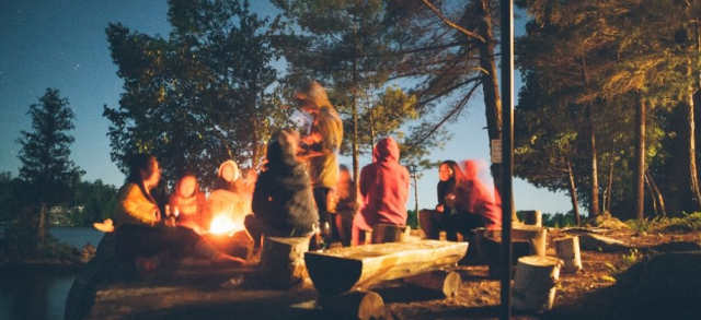 People gathered around the campfire