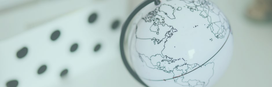 Small globe with dots in the background