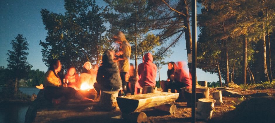 People gathered around the campfire