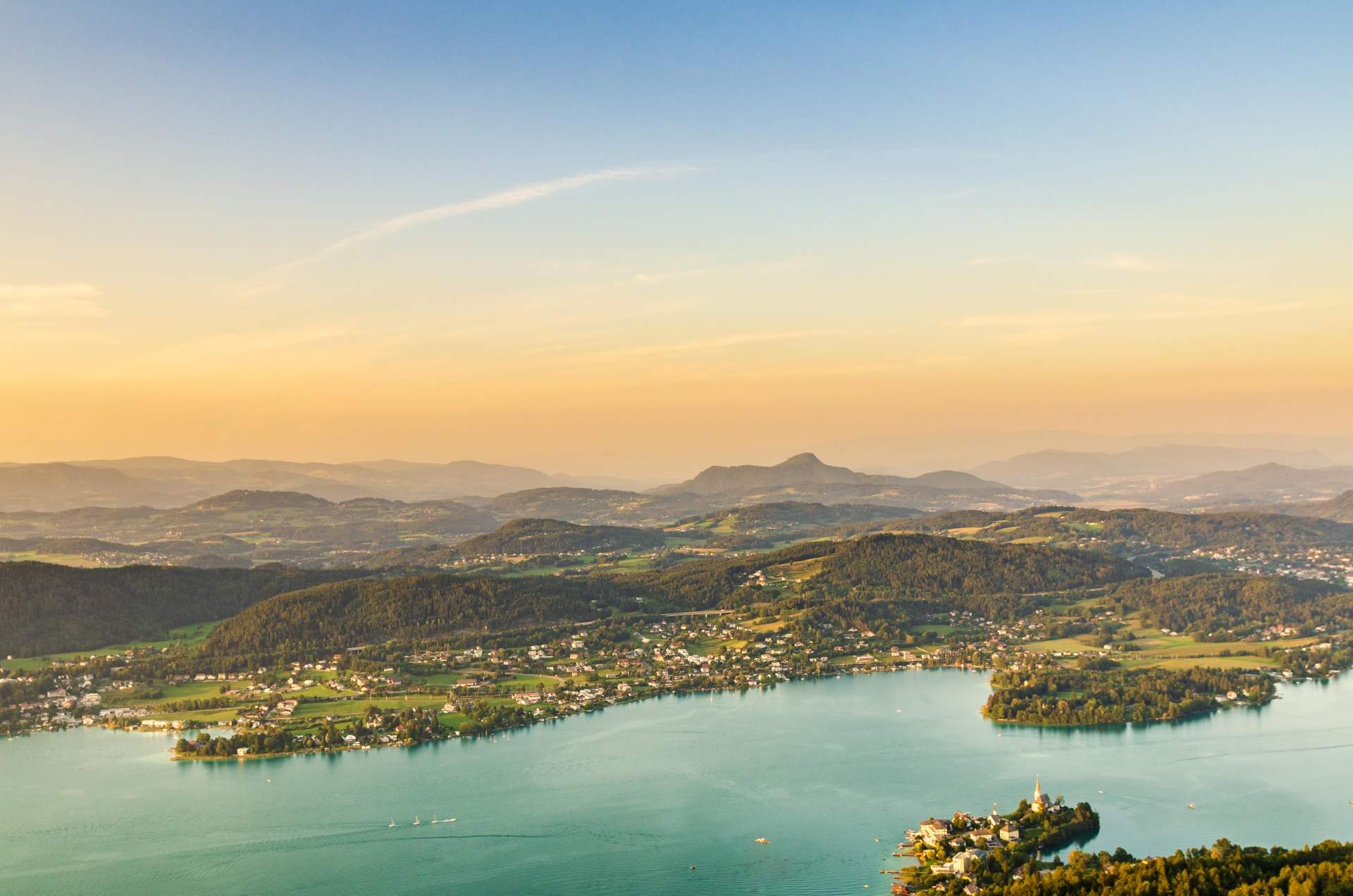 Lake and mountains at Worthersee Karnten Austria. View from Pyramidenkogel tower on lake and Klagenfurt the area.