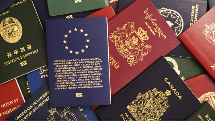 241074_Mixed-biometric-passports-of-many-countries-of-the-world.-In-the-foreground-is-a-European-Union-passport..jpg