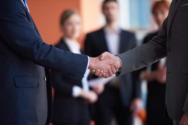 business partners, partnership concept with two businessman handshake