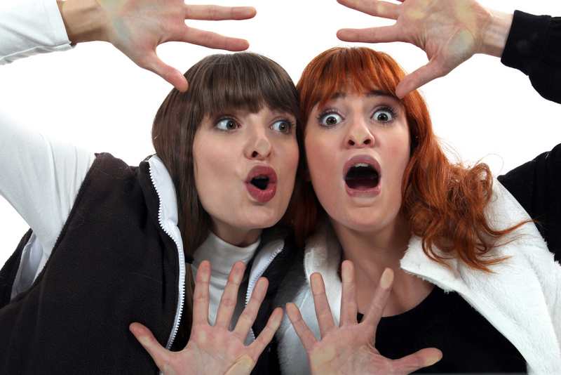 Women with their faces pressed against glass