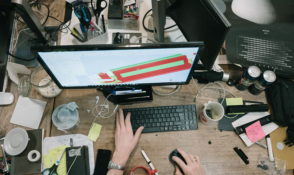 An engineering student works on a project on their computer