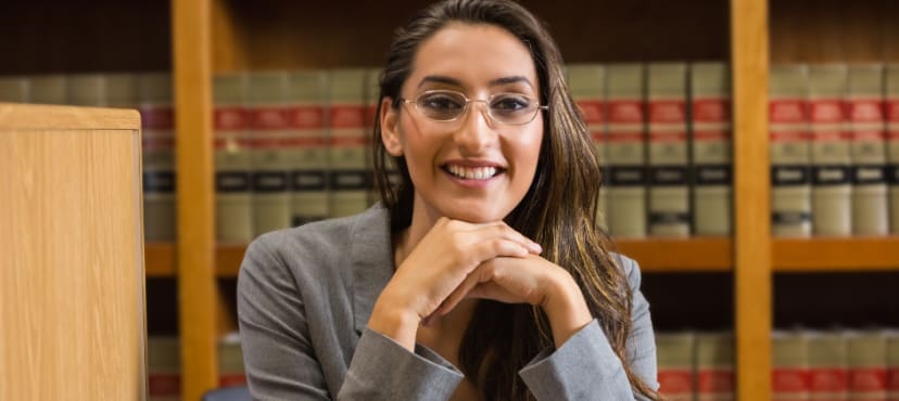 Legal books and judge gavel on wooden desk