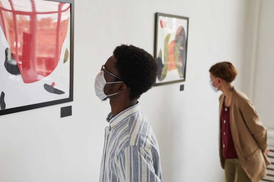 People Wearing Masks Looking at Modern Art