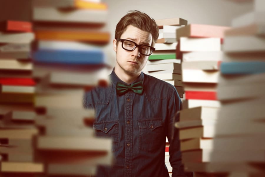 Student between book stacks