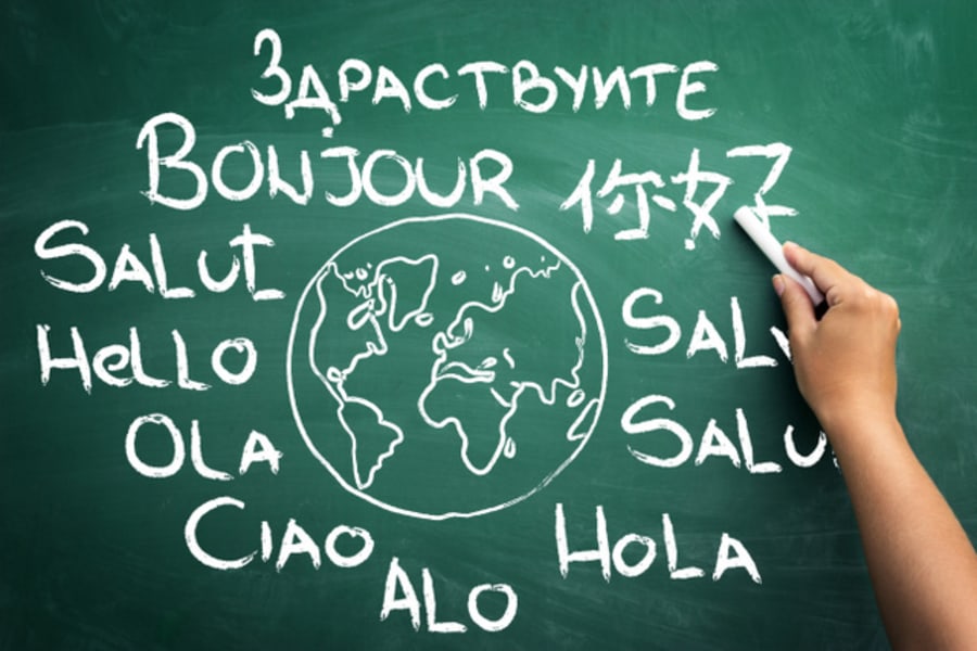 Word hello in all languages of the world on blackboard