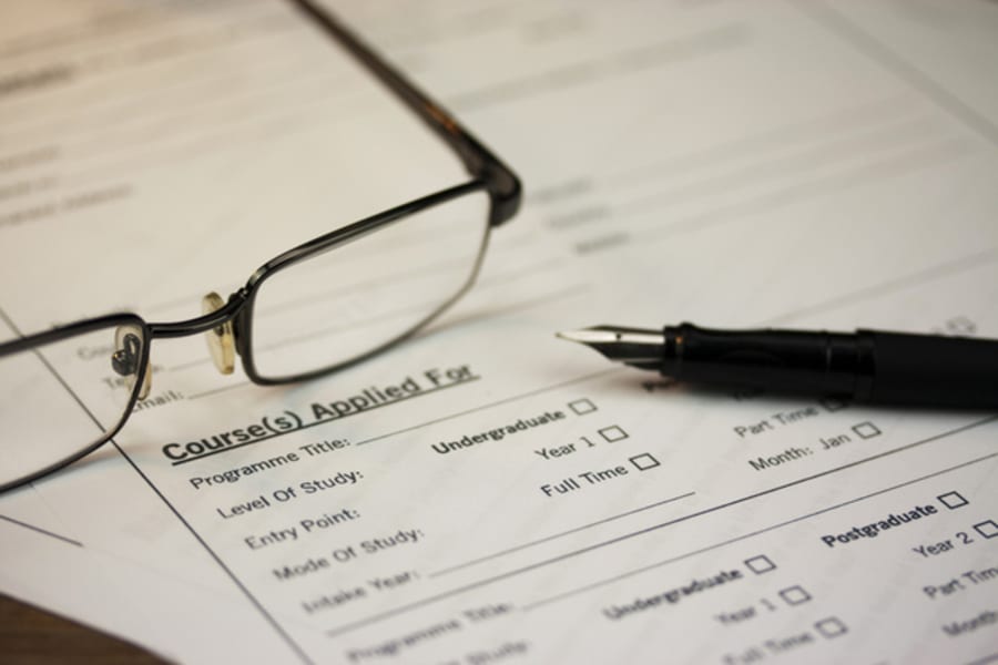 Close up of a fountain pen on a university application form
