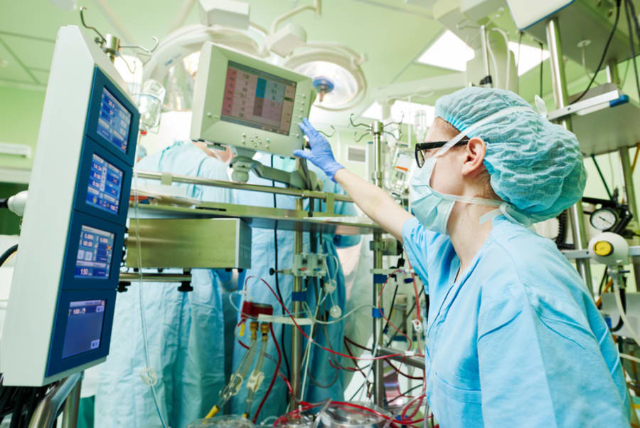 Surgery assistant perfusionist at modern heart lung machine