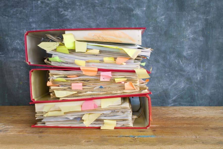 stack of messy file folders and documents,free copy space