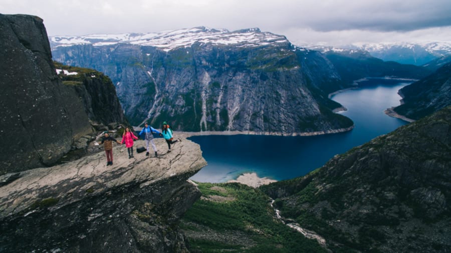 People on rocks harsh Norway, Trolltunga