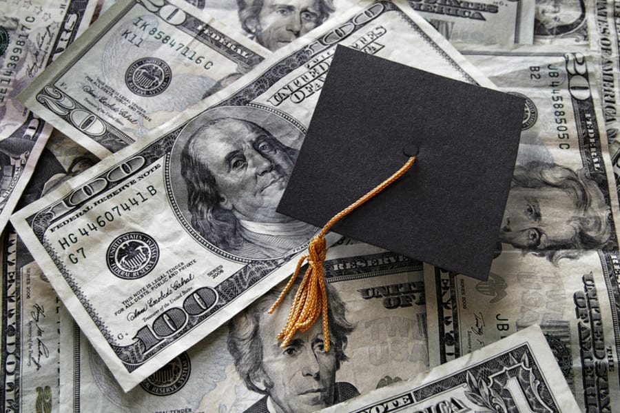 Small graduation cap on assorted cash