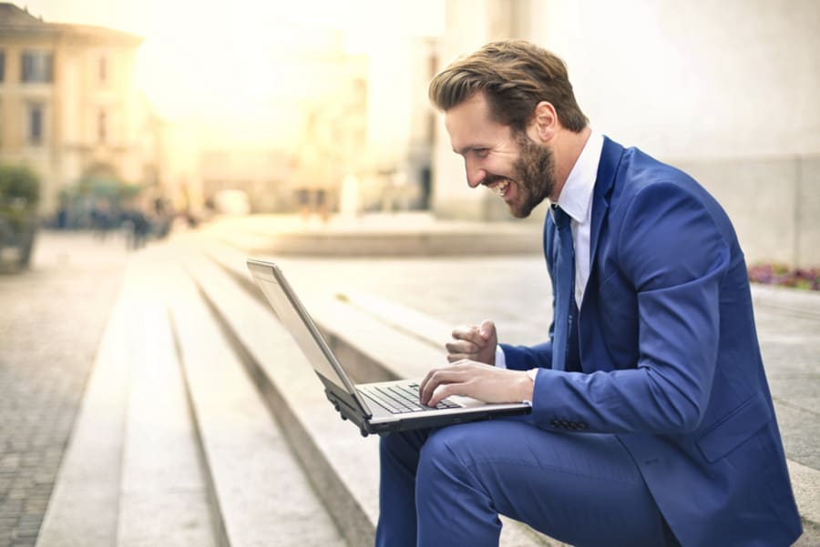 Handsome businessman using a laptop