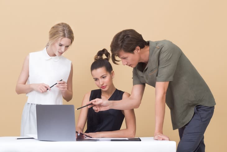 127379_two-woman-and-one-man-looking-at-the-laptop-1036641.jpg