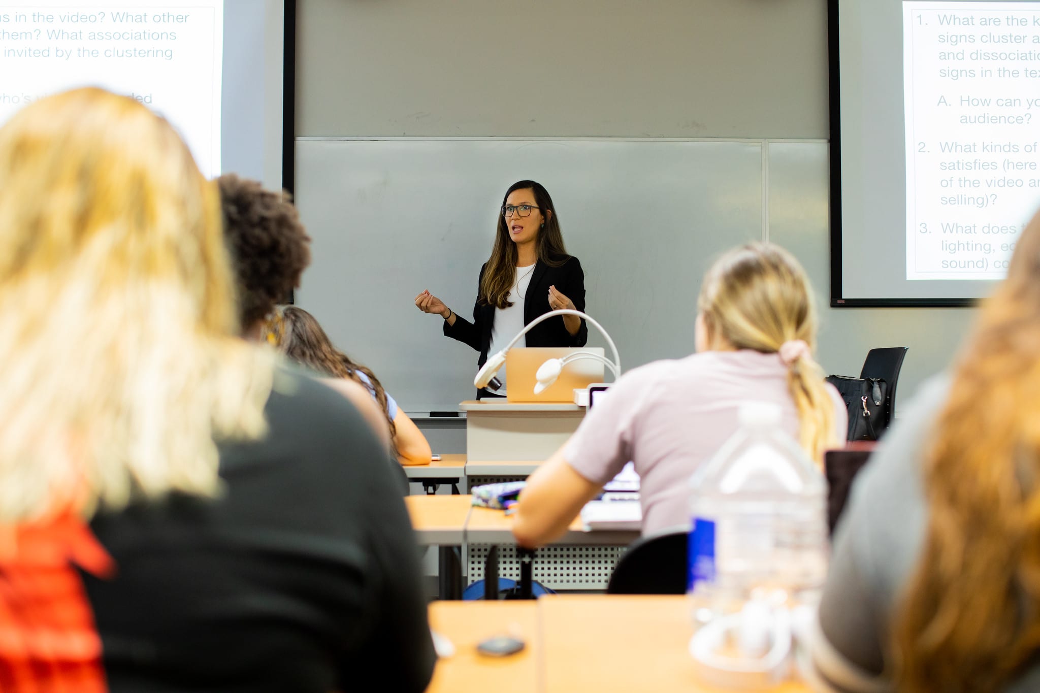 Professor lecturing at the front of a class