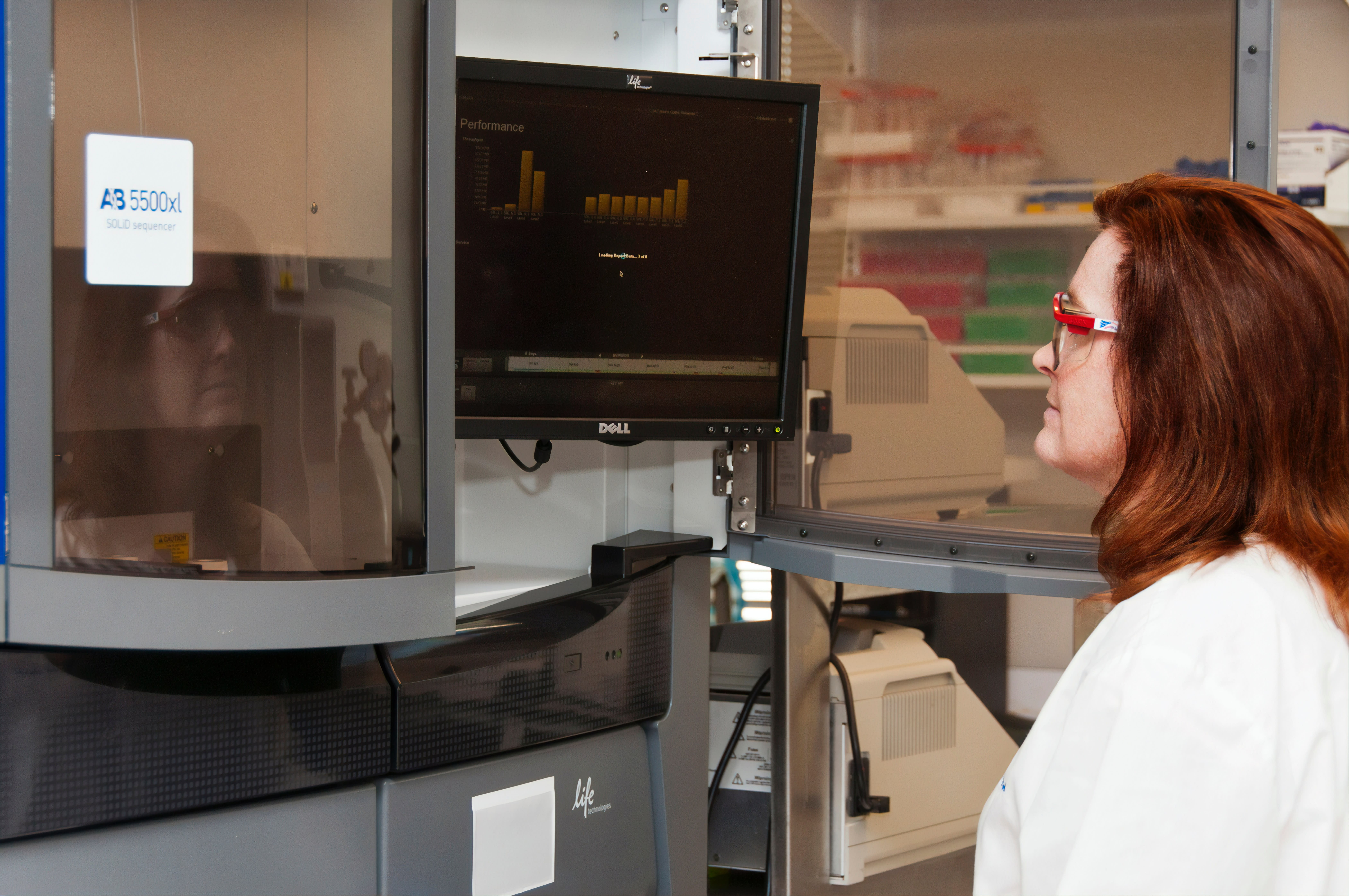 A technician performing an RNA-sequencing experiment on the Life Technologies 5500XL sequencer at the Advanced Technology Research Facility (ATRF), Frederick National Laboratory for Cancer Research, National Cancer Institute.
