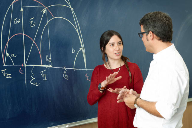 Student girl talking with professor