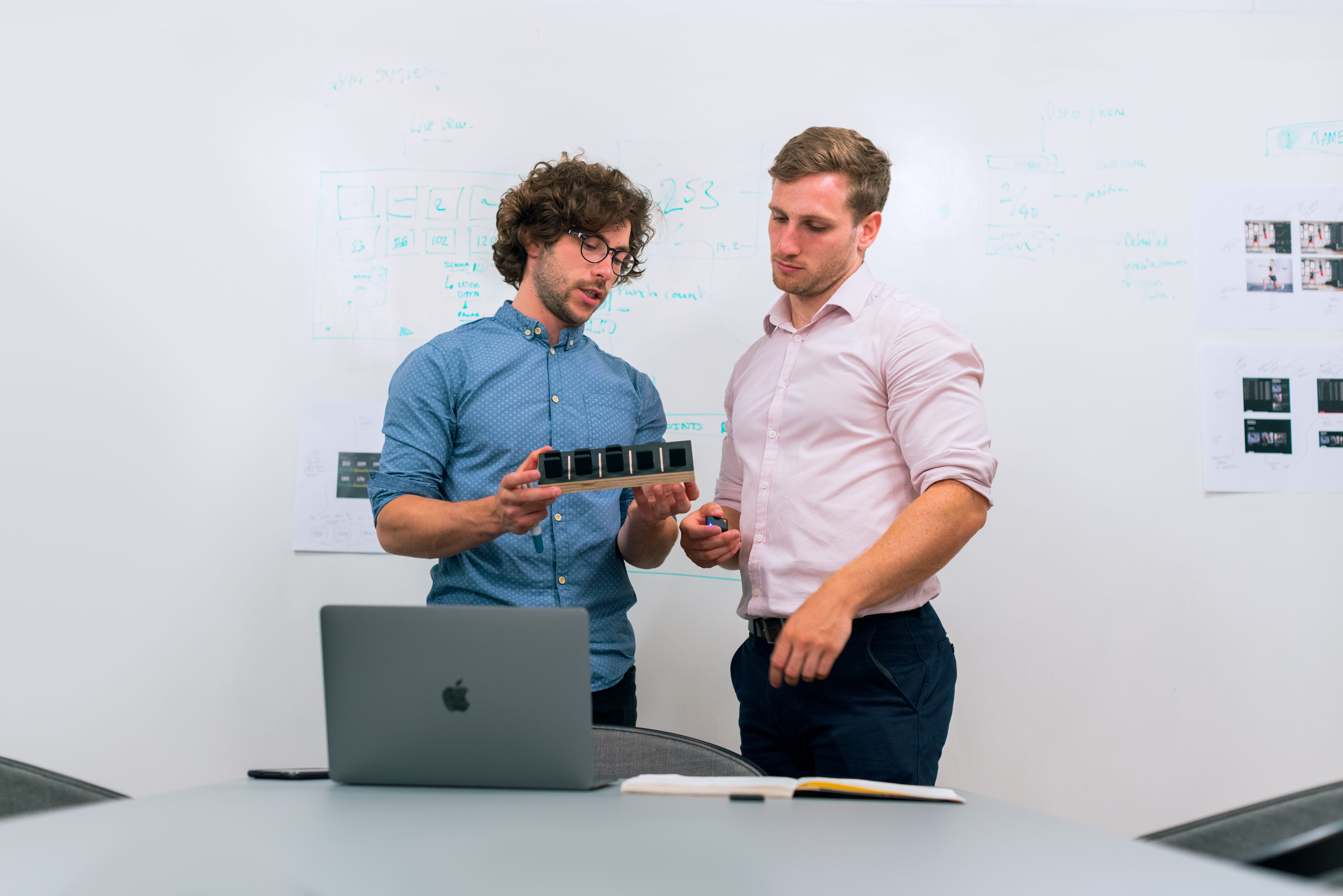 Male engineers design boxing performance trackers