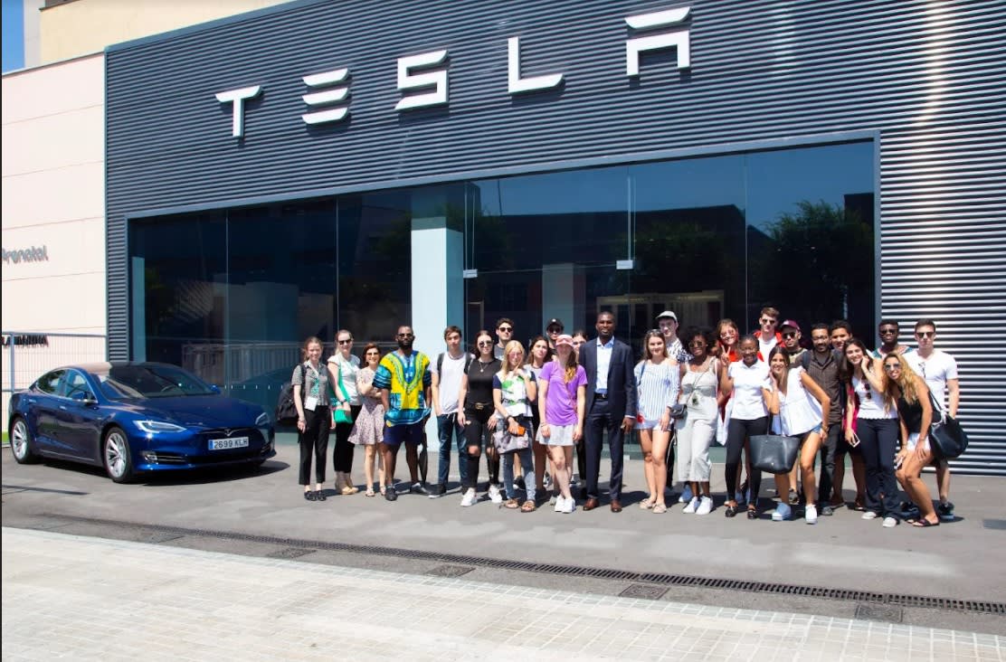 Students at a Tesla factory