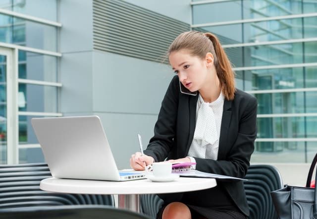 Young business woman working portrait