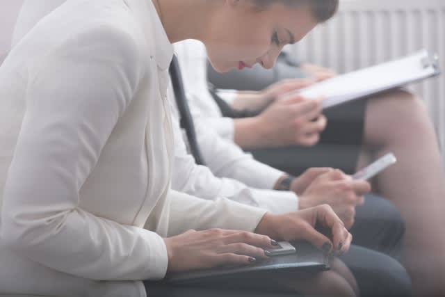 Image of corporate worker writing psychological test