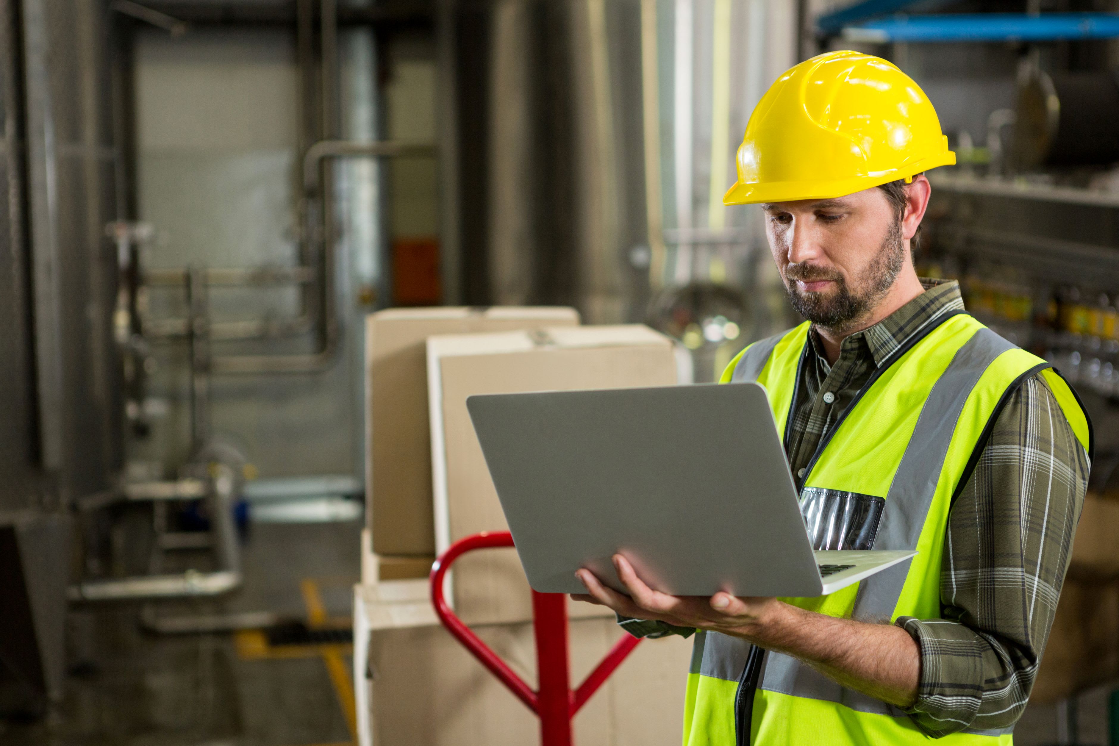 247808_male-worker-using-laptop-distribution-warehouse.jpg
