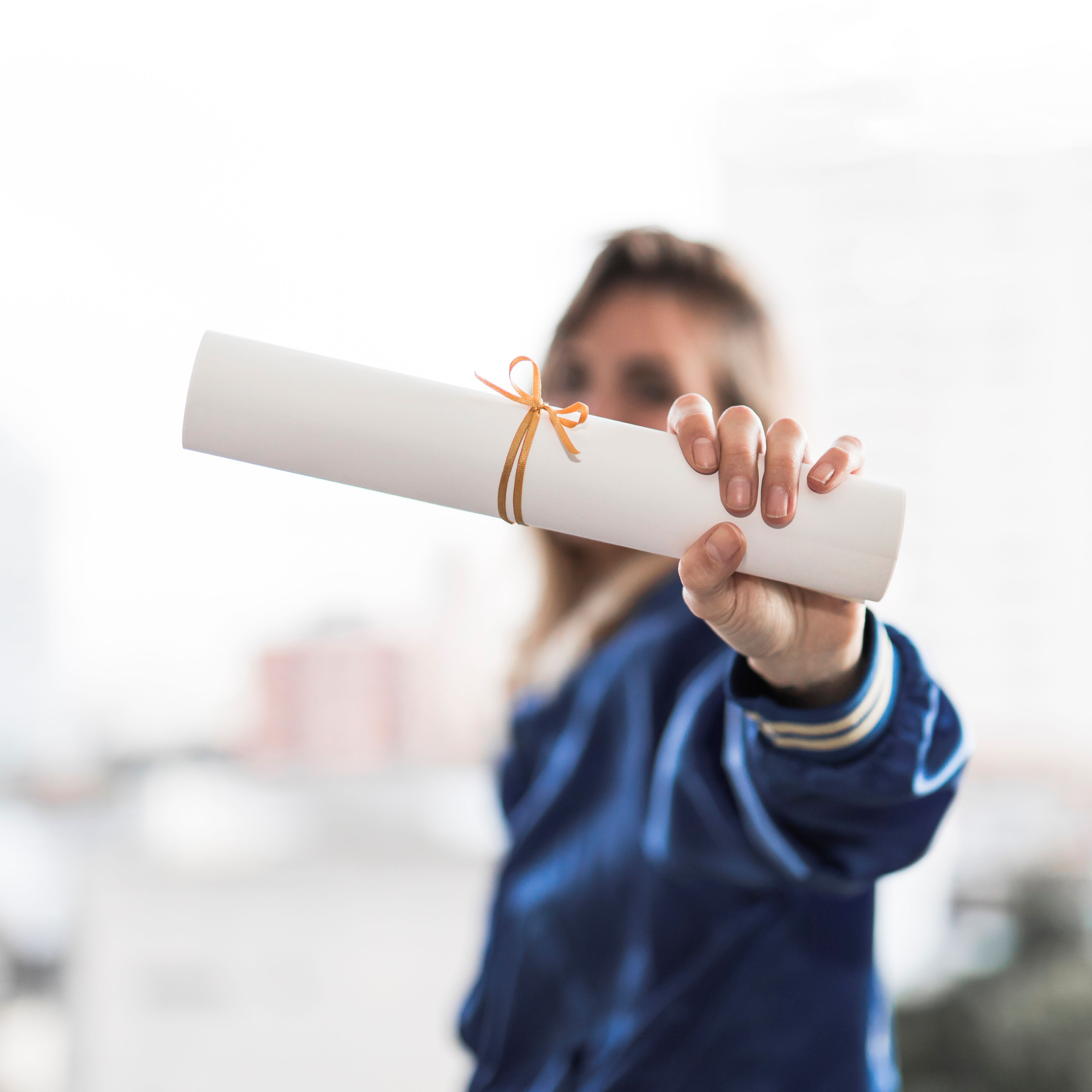 248056_anonymous-lady-demonstrating-diploma.jpg