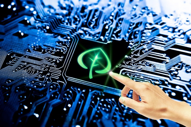 hand pointing to symbol of a leaf on computer circuit board