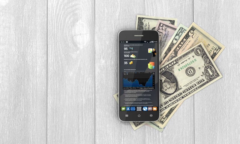 Mobile phone with statistic in screen and money with credit cards on wood background. Concept of payment and savings. 3d illustration