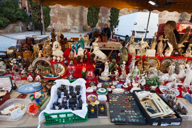 BARCELONA, SPAIN - FEBRUARY 20, 2014: Old ceramic things at flea market  before  Barcelona Cathedral