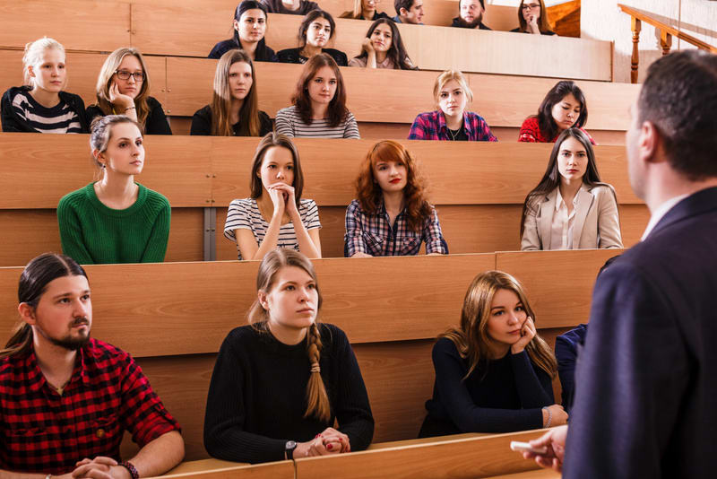 Teacher explaining something to students