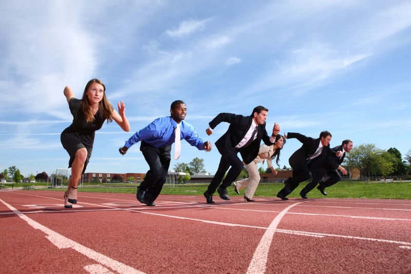 Business people racing on track