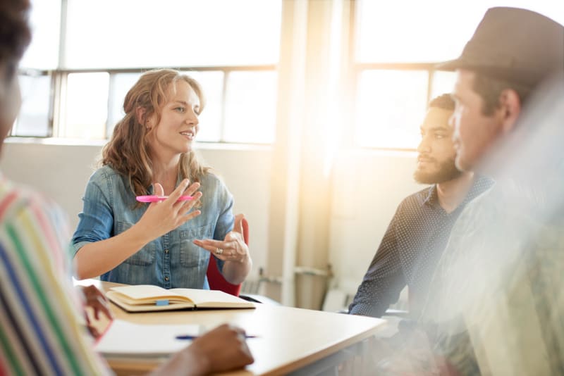 Unposed group of creative business people in an open concept