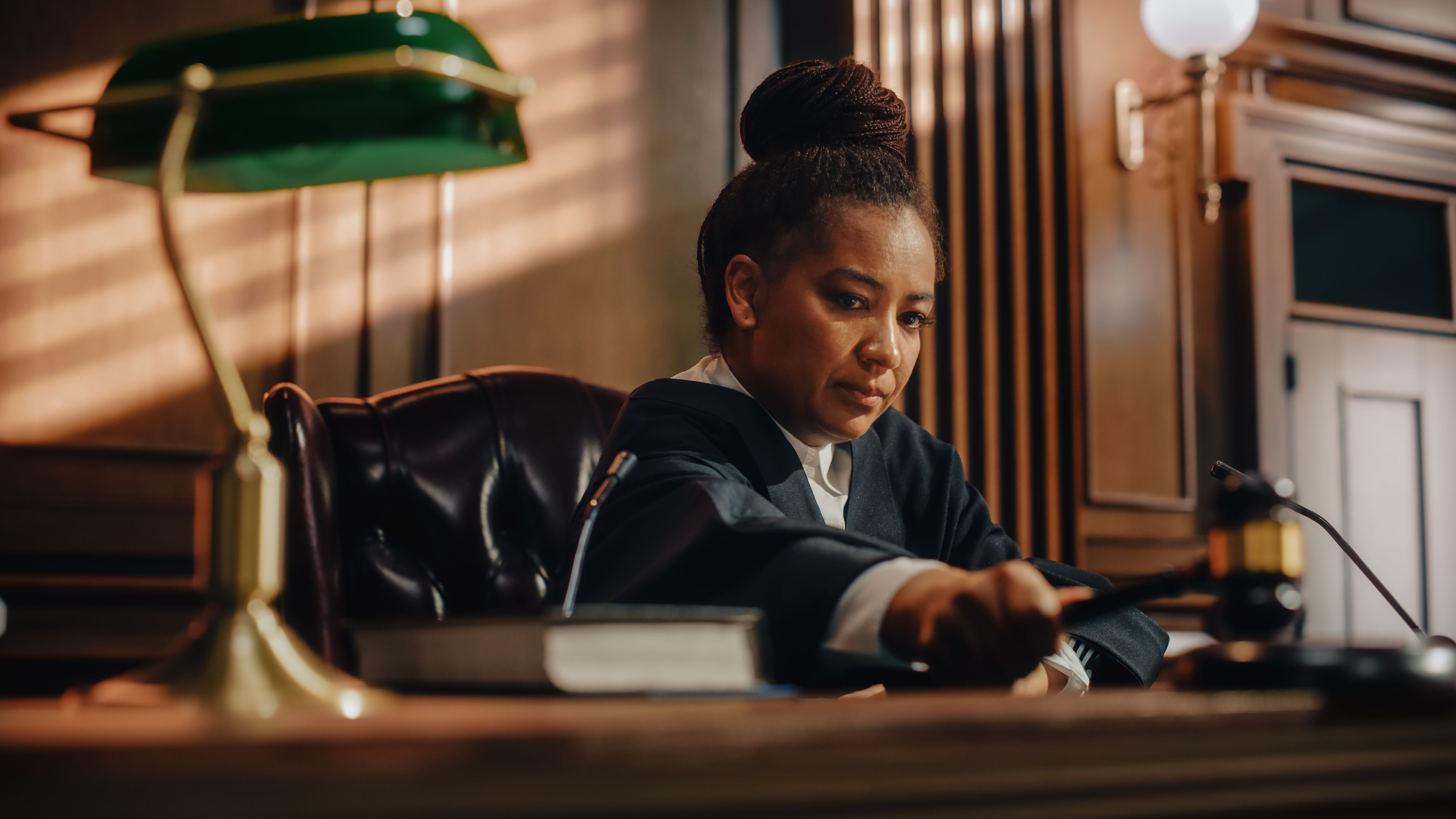 Female judge reading mock trial decision