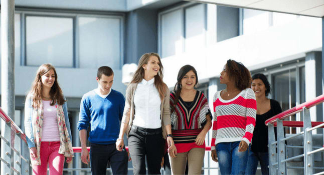 Students walking and talking together at university