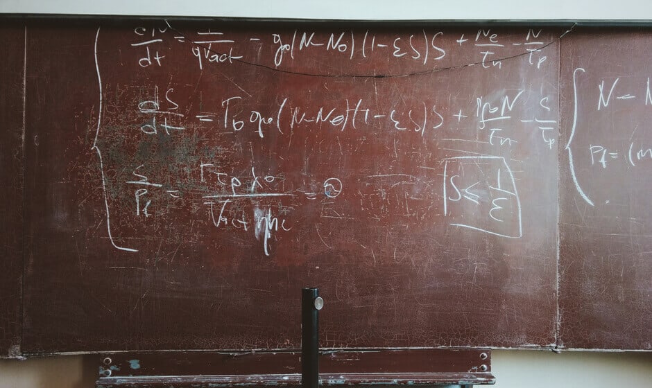 Blackboard with mathematical equation written on it