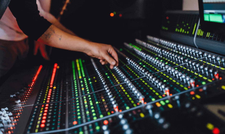 Person mixing music in recording studio