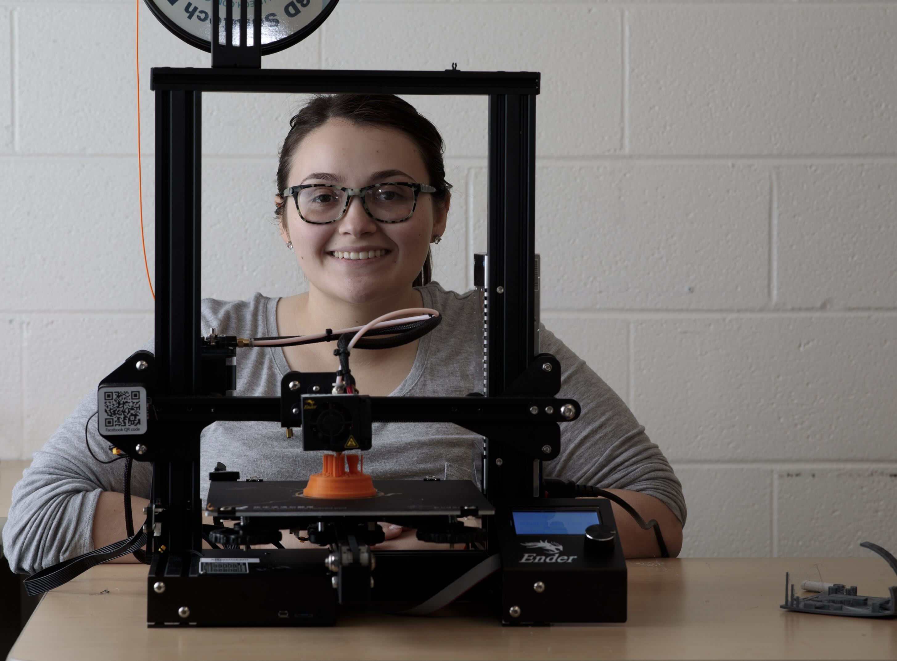 Ohio Northern University College of Engineering freshman Jennifer Hahn is photographed at the 3D printer.