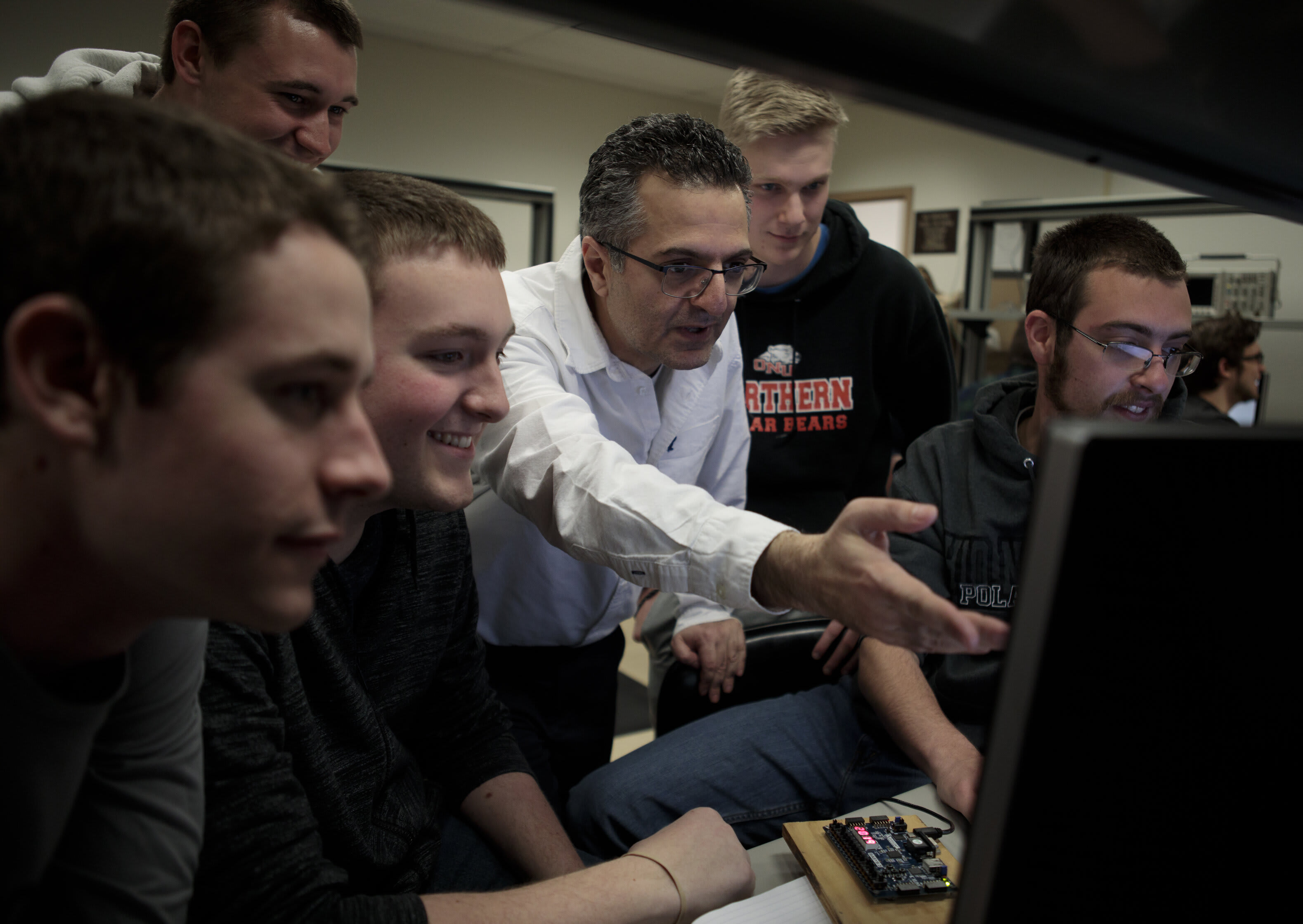 Firas Hassan, associate professor of electrical engineering, works with Ohio Northern University College of Engineering students.