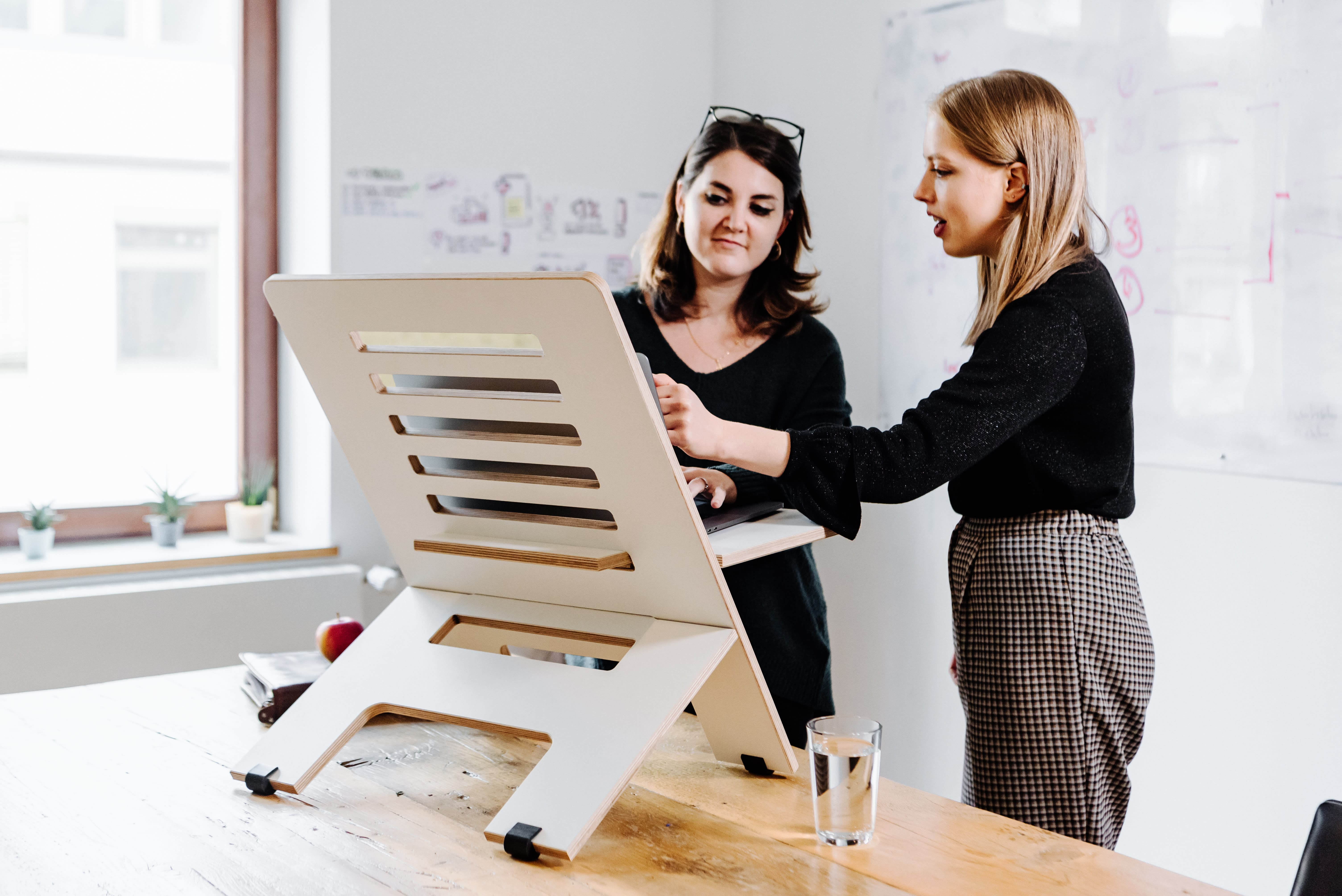 Women working upright on a standing desk