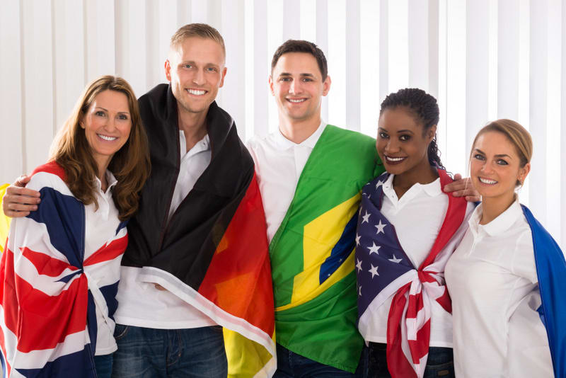 Group Of Happy Patriotic People With Flags From Different Countries