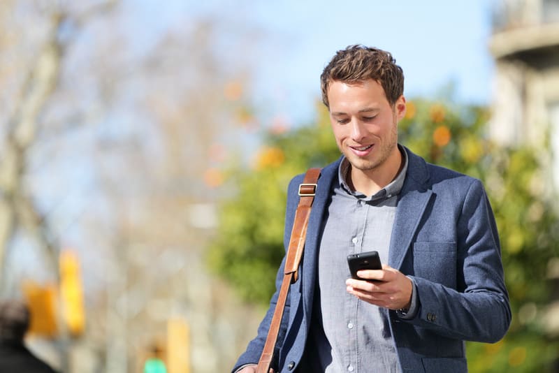 Young urban businessman professional on smartphone