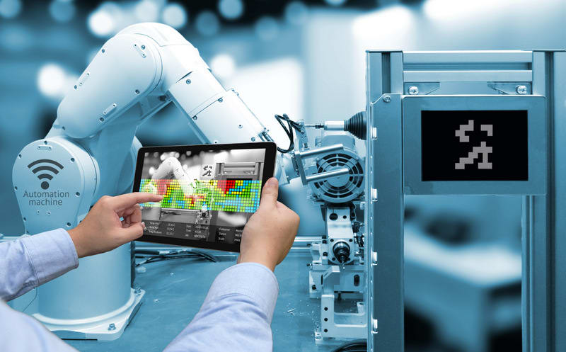 Industry 4.0 concept .Man hand holding tablet with Augmented rea