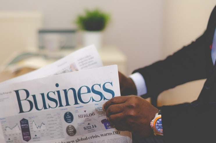 Businessman opening a paper Businessman opening a paper