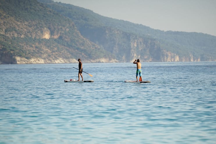 Two Men on Canoes Two Men on Canoes