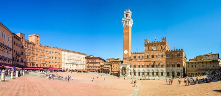 Panorama of Piazza del Campo (Campo square), Palazzo Publico and Torre del Mangia (Mangia tower) in Siena, Tuscany, Italy