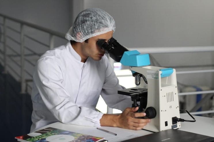 man sight on white microscope man sight on white microscope